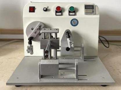 Hinge durability testing machine in an eyewear factory QC lab