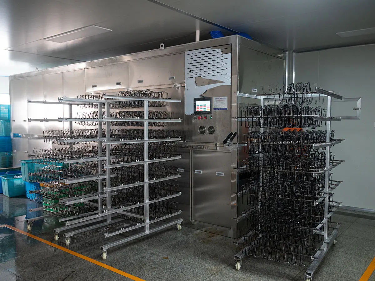Ultrasonic cleaning line for metal eyeglass frames at Dongtian factory
