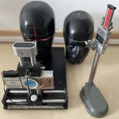 Impact testing headform and equipment — every US-bound lens batch must pass the FDA drop ball test